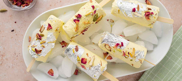 Green cardamom and saffron kulfi with pistachios, rose petal and edible silver leaf