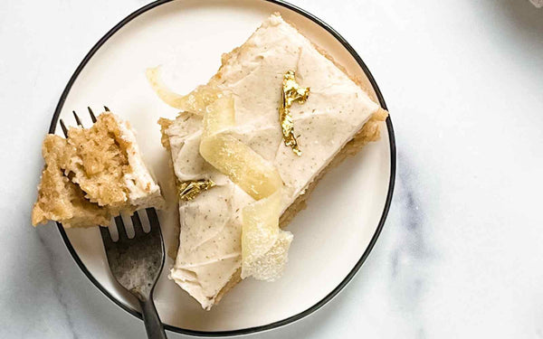 parsnip tres leches cake with clove and nutmeg buttercream garnished with edible gold leaf 