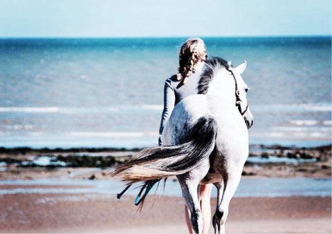 Actress Harriet Jones with her horse, Rose, on the beach