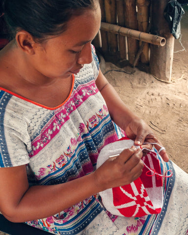 Wayuu woman weaving a Wayuu Mochila Bag