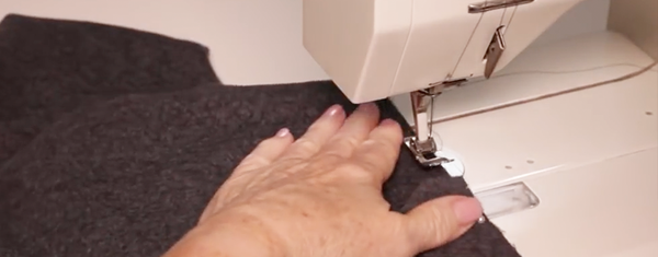 the draped coat stitching the pocket