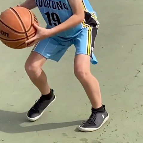 Andy’s son wearing Vivobarefoot while he plays basketball. | Sole Mechanics Blog