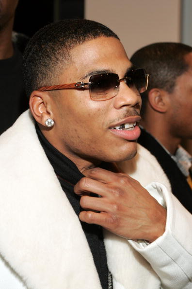 Nelly wears Cartier glasses frames