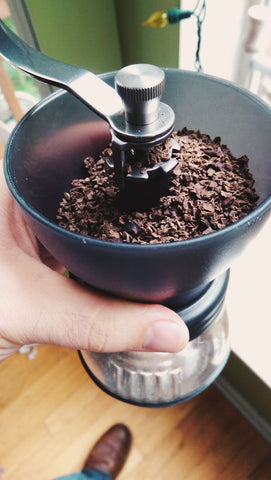 Acorns in a hand grinder.