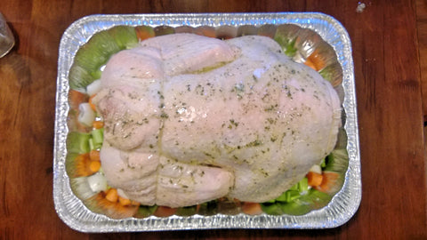 Cover the turkey with butter, parsley, salt and pepper.