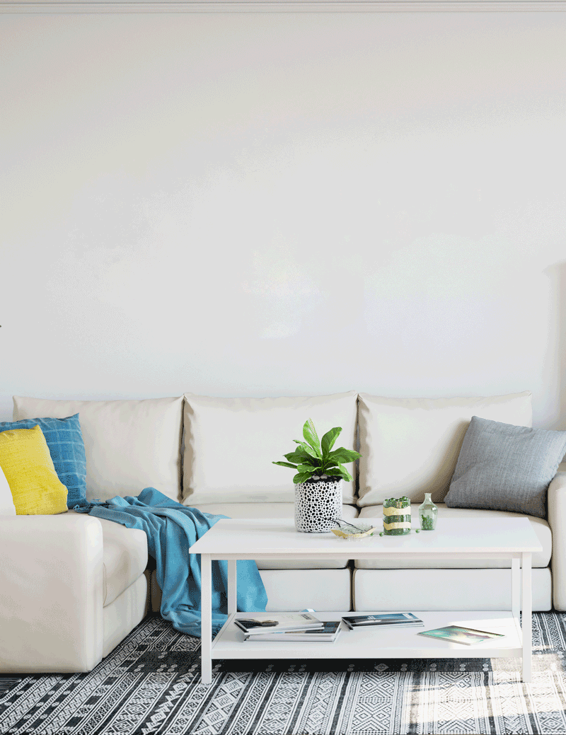 gallery wall in yellow and blue hangin on living room - 7 Ways Art Can Improve Your Room Decor