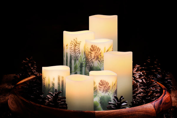 Flameless Candles set into a bowl with decorative greenery