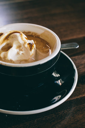 affogato in black and white cup with saucer