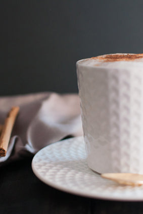 cinnamon cappuccino in a white ceramic cup