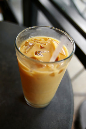 iced coffee in clear glass on dark table