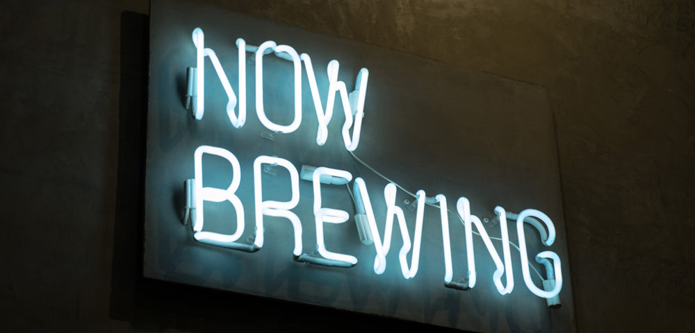 now brewing neon sign on black background