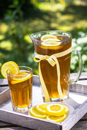 iced coffee lemonade in clear pitcher with lemon slices