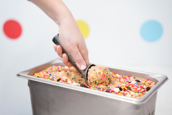 image of someone scooping cookie dough