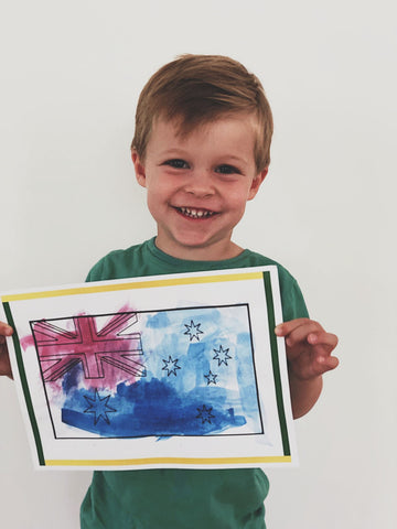 Little boy with finished artwork
