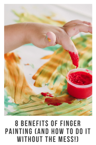 childs hand in finger paint