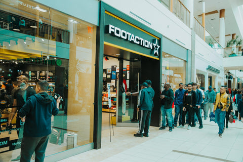 Footaction line up waits for Claudio the barber haircuts and Reebok event - Fade Room barbershop