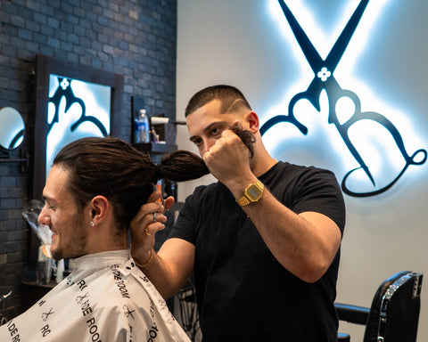 What length does your hair have to be to donate? Men's hair getting cut for donations. Claudio Ferreira at Fade Room barbershop in Toronto, Ontario