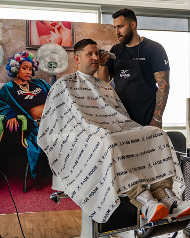 Joshua Dos Santos, Fade Room barber at the Reebok event Reebok barbershop