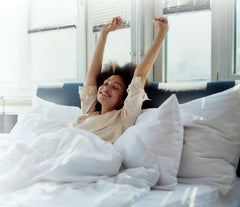 Woman waking up refreshed