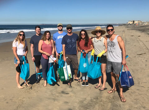 Pure Bliss Bikinis Team hosting a beach cleanup at Imperial Beach
