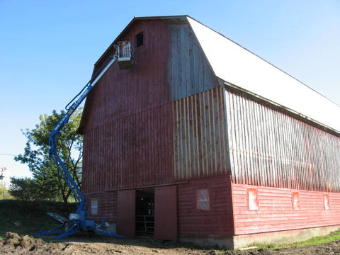 Back of dairy barn with lift to paint at Devine Gardens