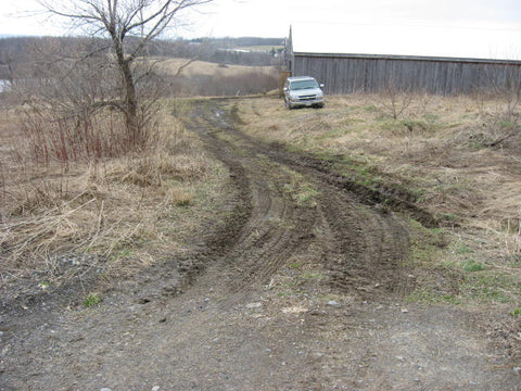Mud driveway at pole barn at Devine Gardens