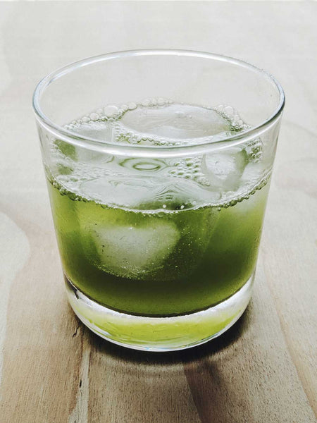 A glass of iced, cold brew matcha tea