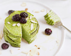 Green matcha pancakes sit on a plate as an example of emerging food industry trends of 2020