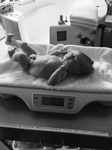 Baby Eadie being weighed after birth