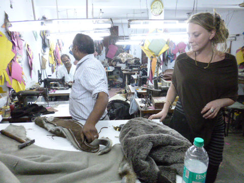 A picture of designer and creator Tina Payne in a fair trade factory creating ethical and sustainable products