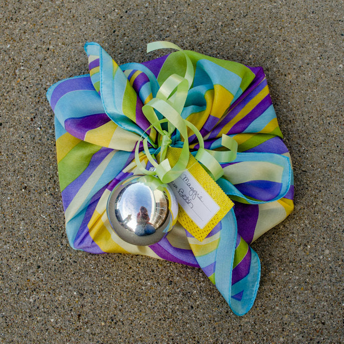 gift wrapped with a square scarf