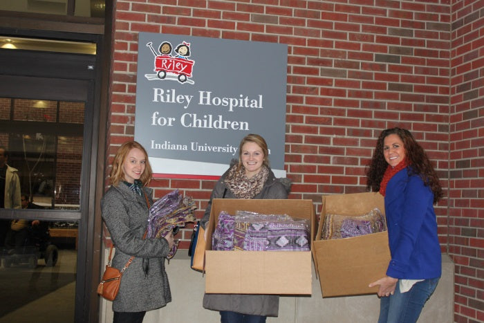 donating boxes of scarves to the Riley Hospital for Children