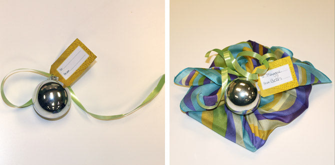 Adding a card, ribbon and a silver christmas ball at the midpoint