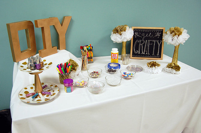 displaying the DIY paper mache letters on the craft table