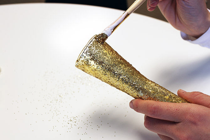 painting on the gold glitter for the sparkling vase