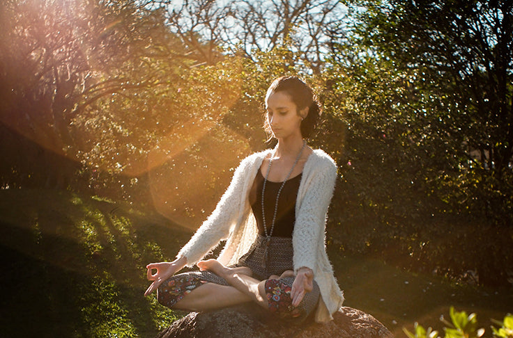 woman meditating ned cbd products