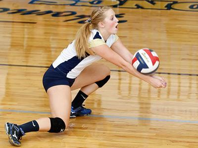 Volleyball Player Digs While Wearing Knee Pads