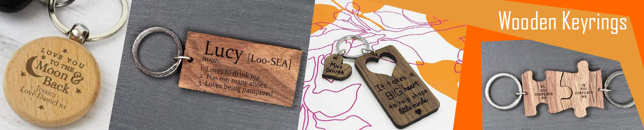 A collection of our wooden engraved keyrings, including a circular one with the message "love you to the moon and back", a rectangular wooden keyring, and 2 jigsaw piece keyrings which fit together.