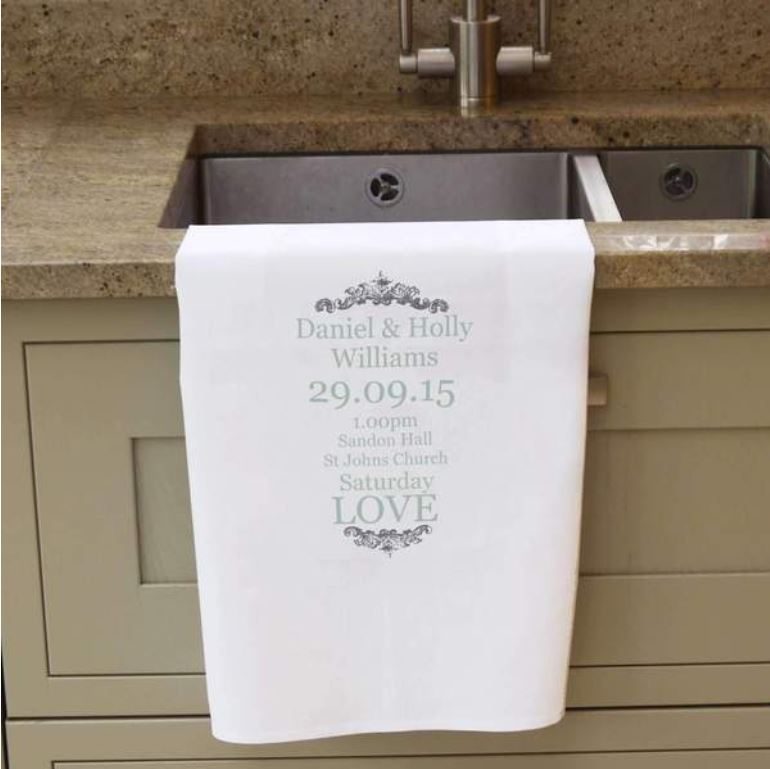 A personalised romantic tea towel. The personalised message is printed in grey and the tea towel is white.