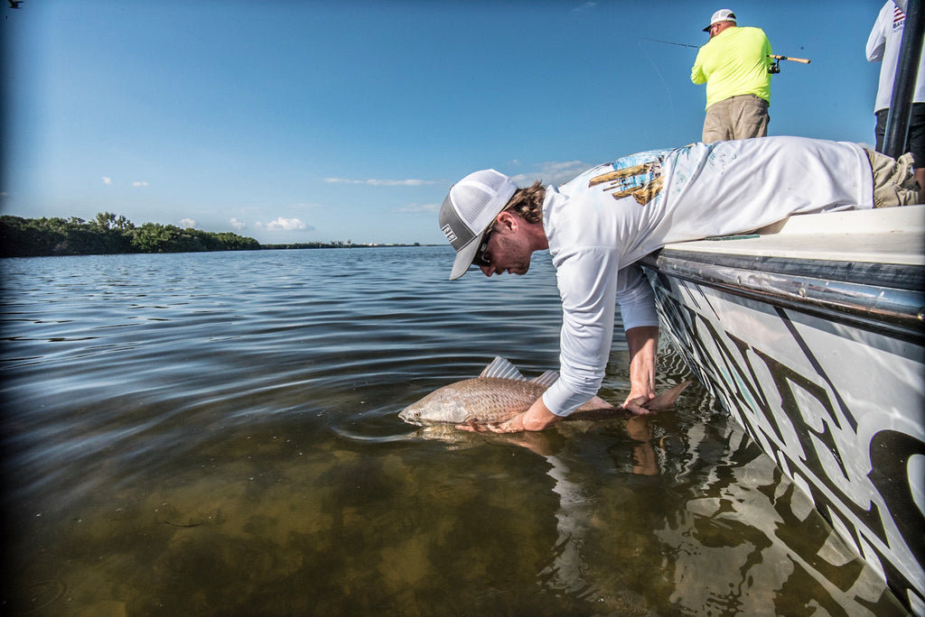 Tim Sommer Releasing a redfish