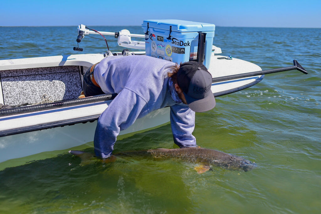 Tim Releasing A Giant Redfish