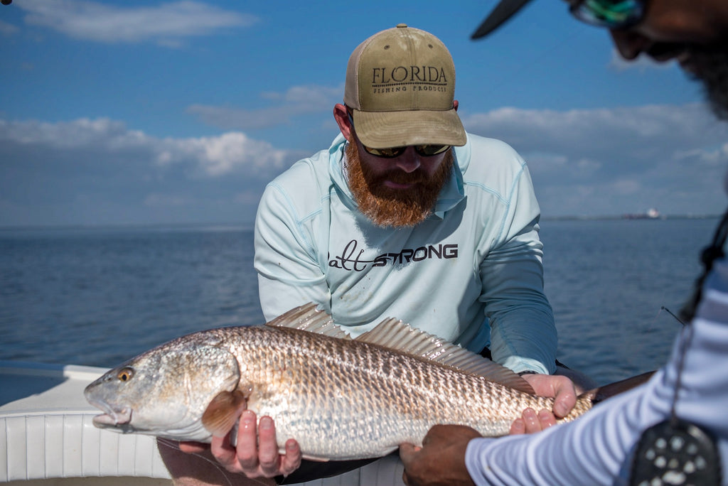 Drew & Captain Mike Goodwine with a Redfish