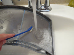 Wash and scrub the dryer lint trap