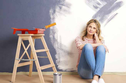 woman painting wall