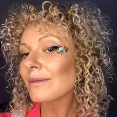 Emily Shurey co-founder wearing highlight glitter