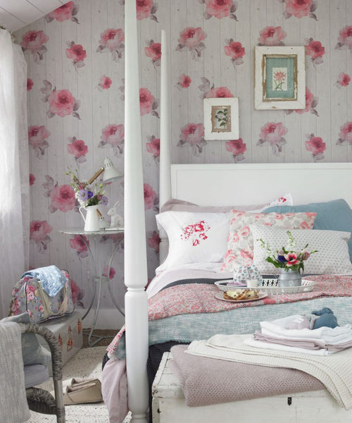 Pink and white floral wall painting in a bedroom