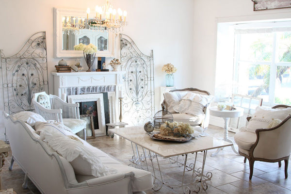 Shubby Chic living room with a mirror in antique white frame