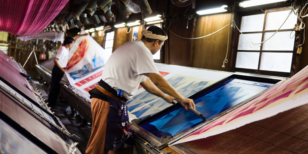 Hand printing furoshiki at the factory in Japan