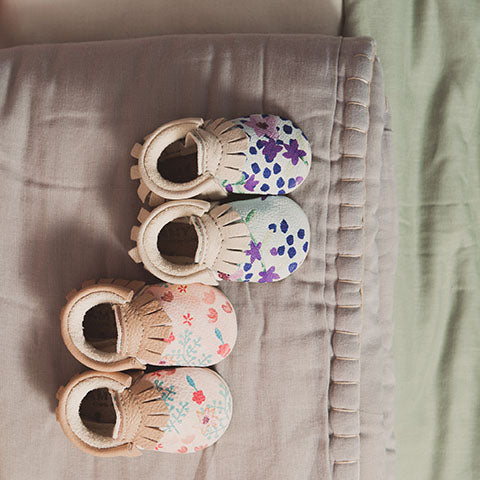 amy and ivor baby moccasins hand painted flowers pink and blue eco and ethically handmade in the uk. Camomile london quilts