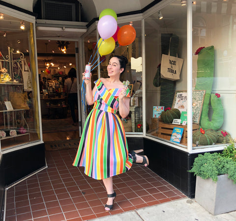 The Little Apple owner Brandy Deieso in front of shop on anniversary.